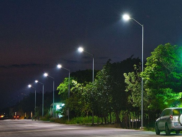 Solar street lighting along a road at night